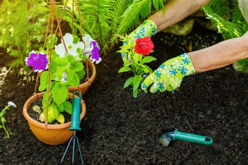 Team member starting gardening shift with tools