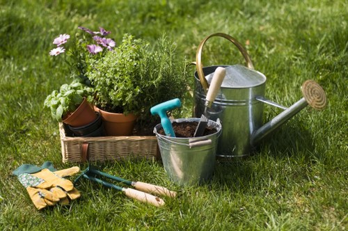 Front view of a small terraced garden in Bethnal Green with tools